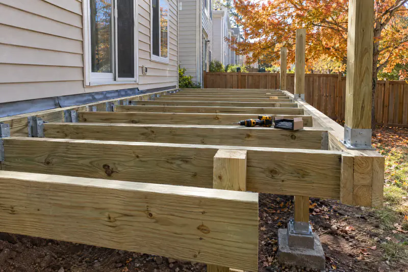 Low deck frame with joist hangers, flashing and blocking ready for a concealment inspection before decking is installed