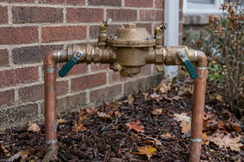 Brass pressure vacuum breaker backflow preventer with ball valves and test cocks set at 45 degrees for winter